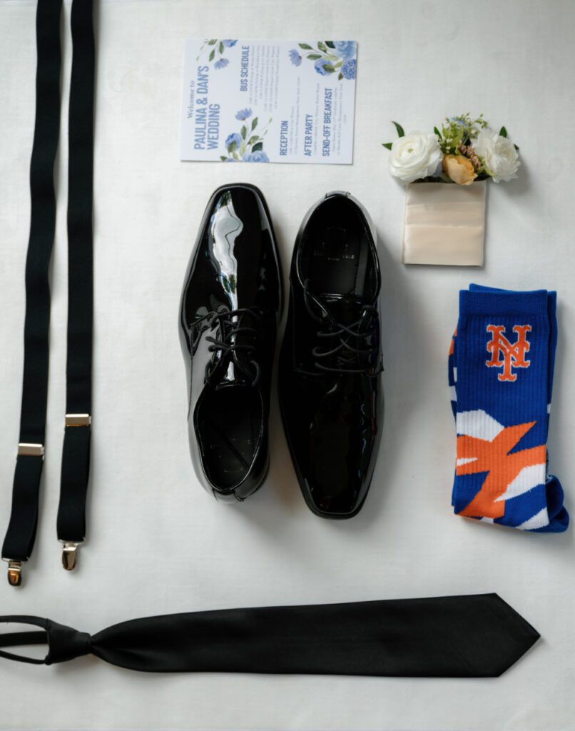 flat lay of grooms wedding accessories. 