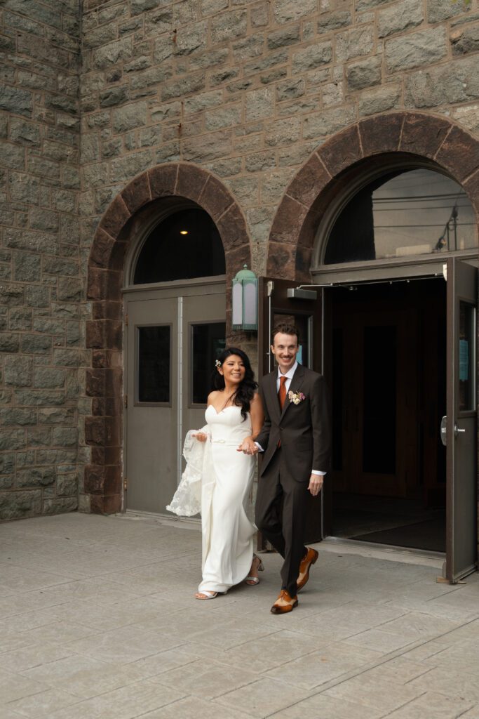 bride and groom leaving wedding ceremony at st peter's church in liberty