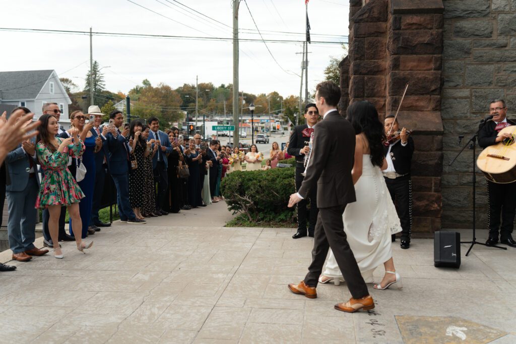 bride and groom leaving wedding ceremony at st peter's church in liberty