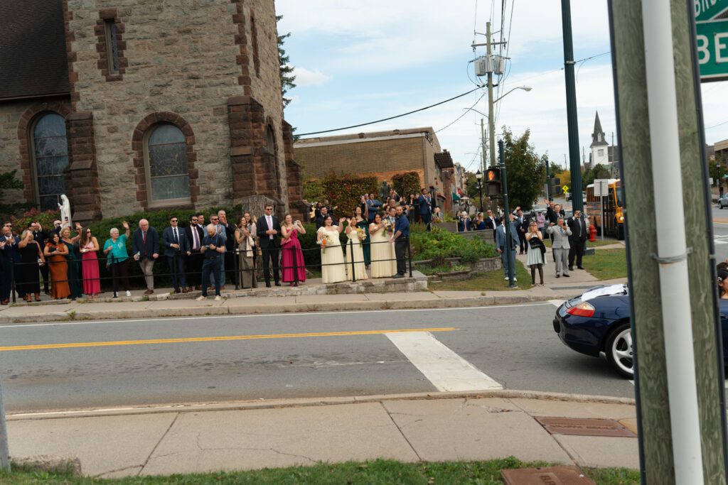 bride and groom leaving wedding ceremony at st peter's church in liberty