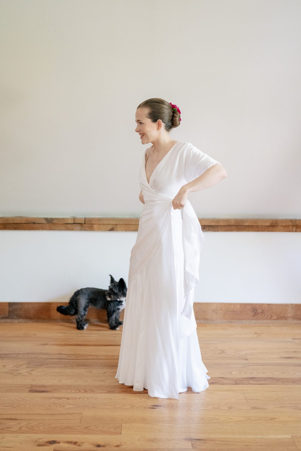 BRIDE GETTING INTO HER WEDDING DRESS