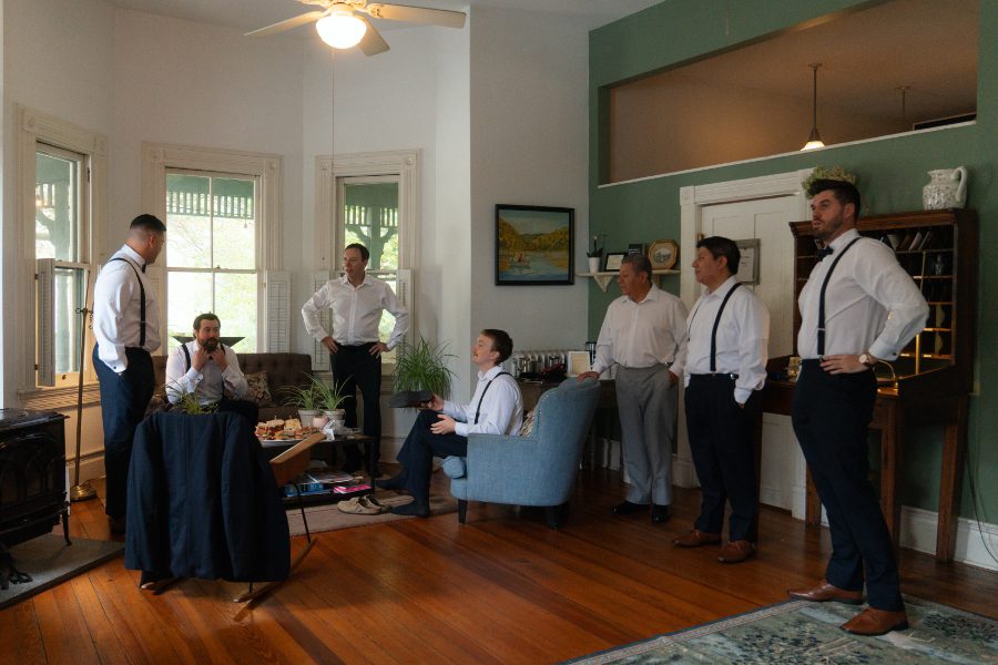 groom and groomsmen dressed and relaxing before the day starts