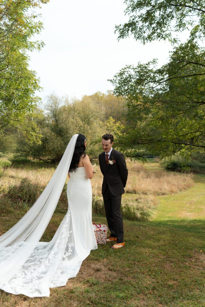 bride and groom outdoor first look portraits for their north branch inn wedding in the catskills