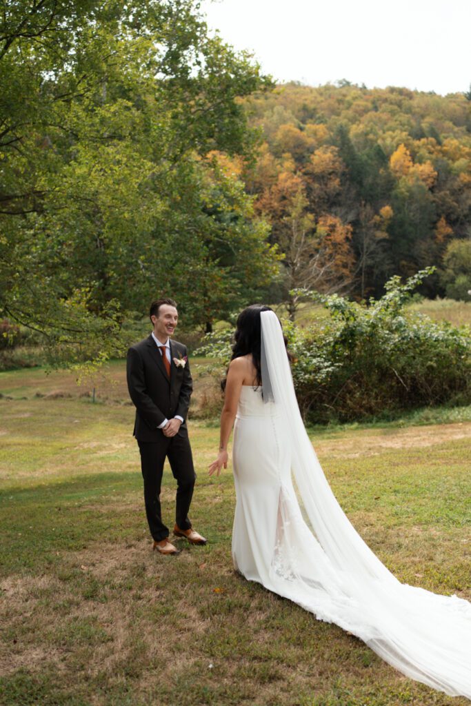bride and groom outdoor first look portraits for their north branch inn wedding in the catskills