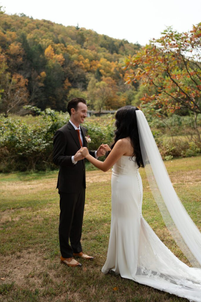 bride and groom outdoor first look portraits for their north branch inn wedding in the catskills