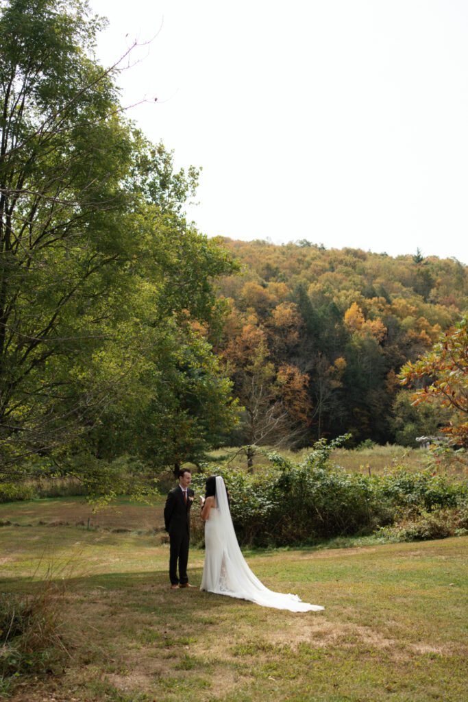 bride and groom outdoor first look portraits for their north branch inn wedding in the catskills