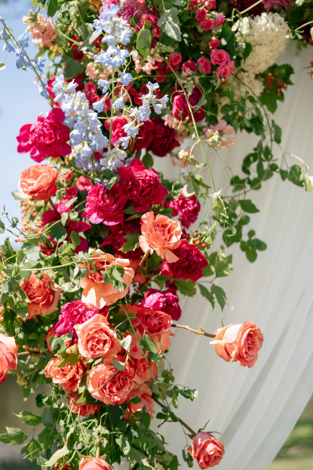 WHITE DRAPERY ARCH AND FLORALS