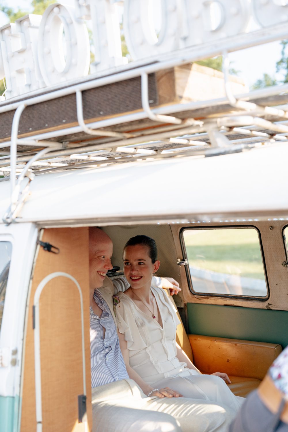 BRIDE AND GROOM PORTRAITS IN NY PHOTO BUS AT WINERY HUDSON VALLEY WEDDING