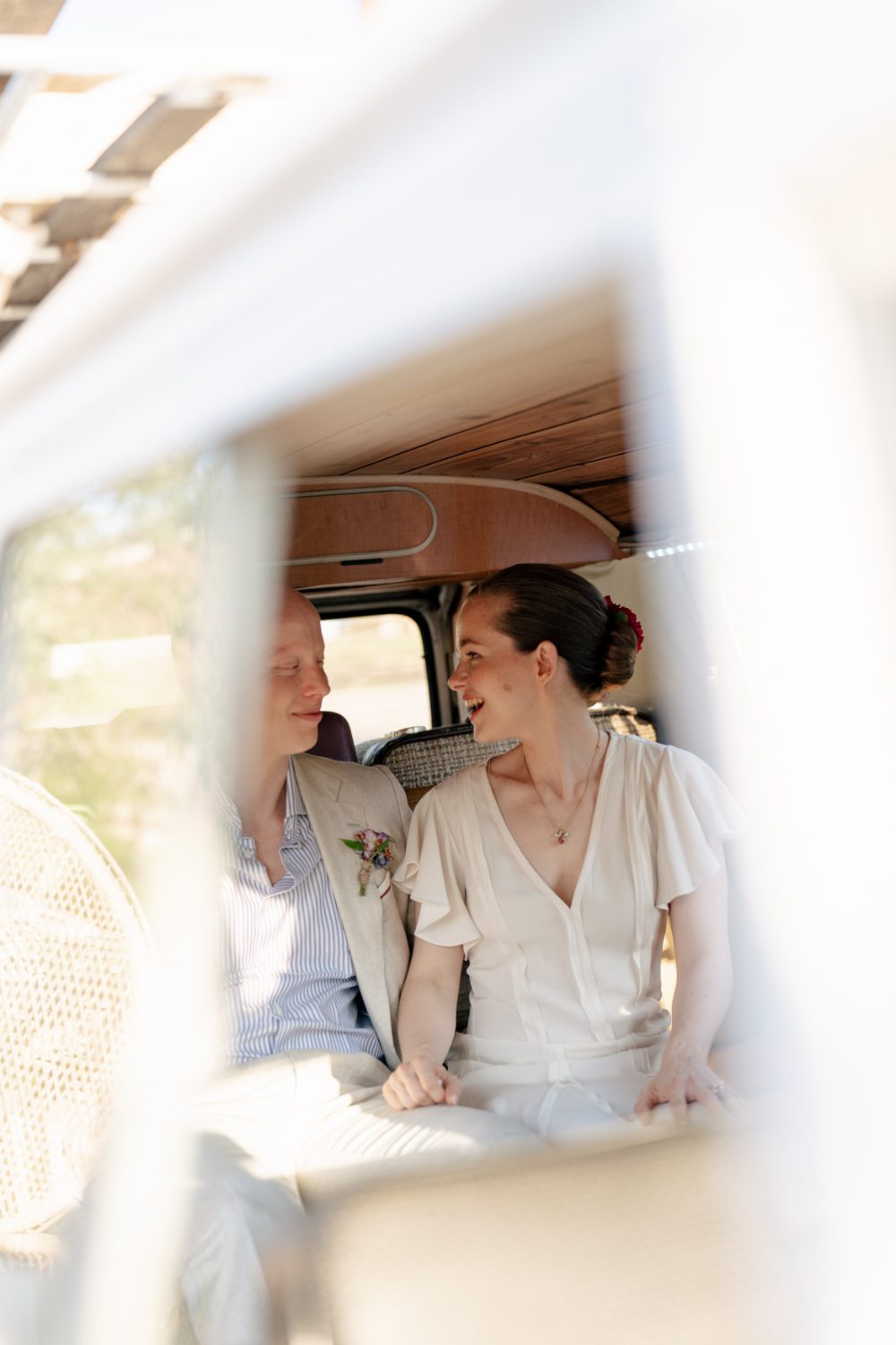 BRIDE AND GROOM PORTRAITS IN NY PHOTO BUS AT WINERY HUDSON VALLEY WEDDING