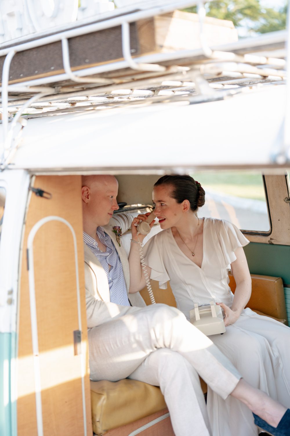 BRIDE AND GROOM PORTRAITS IN NY PHOTO BUS AT WINERY HUDSON VALLEY WEDDING