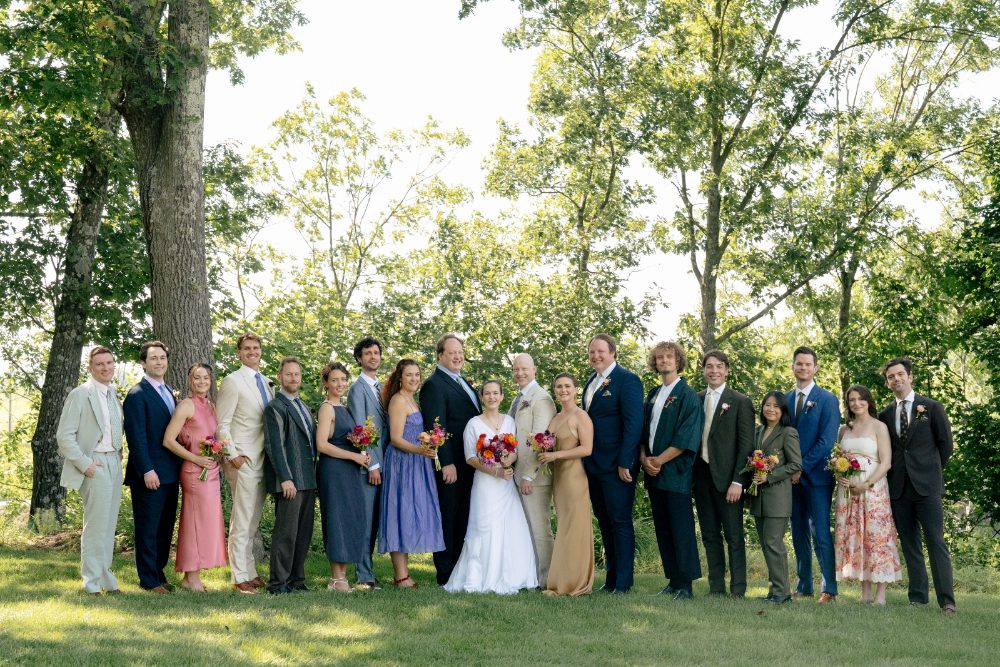 OUTDOOR WEDDING PARTY PORTRAITS WITH PARTY ALL WEARING VERY DIFFERENT OUTFITS