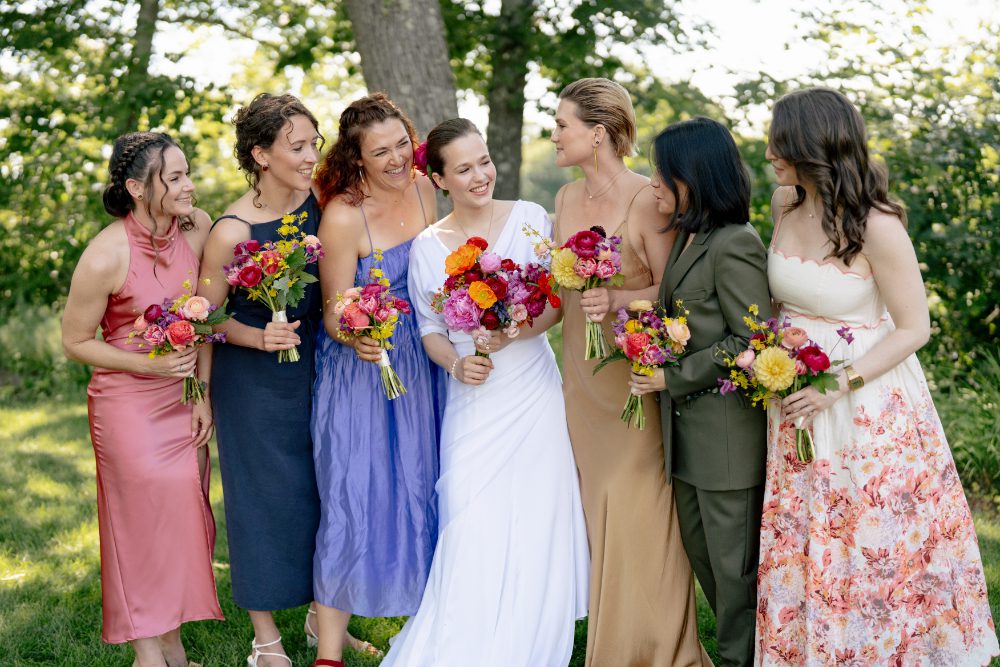 BRIDAL PARTY OUTDOOR WEDDING PORTRAITS WITH BRIDESMAIDS OF VERY DIFFERENT OUTFITS