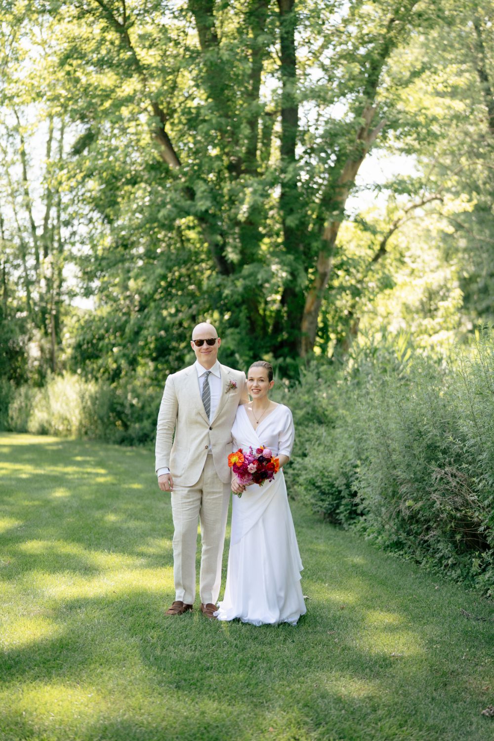 OUTDOOR PORTRAIT OF BRIDE AND GROOM