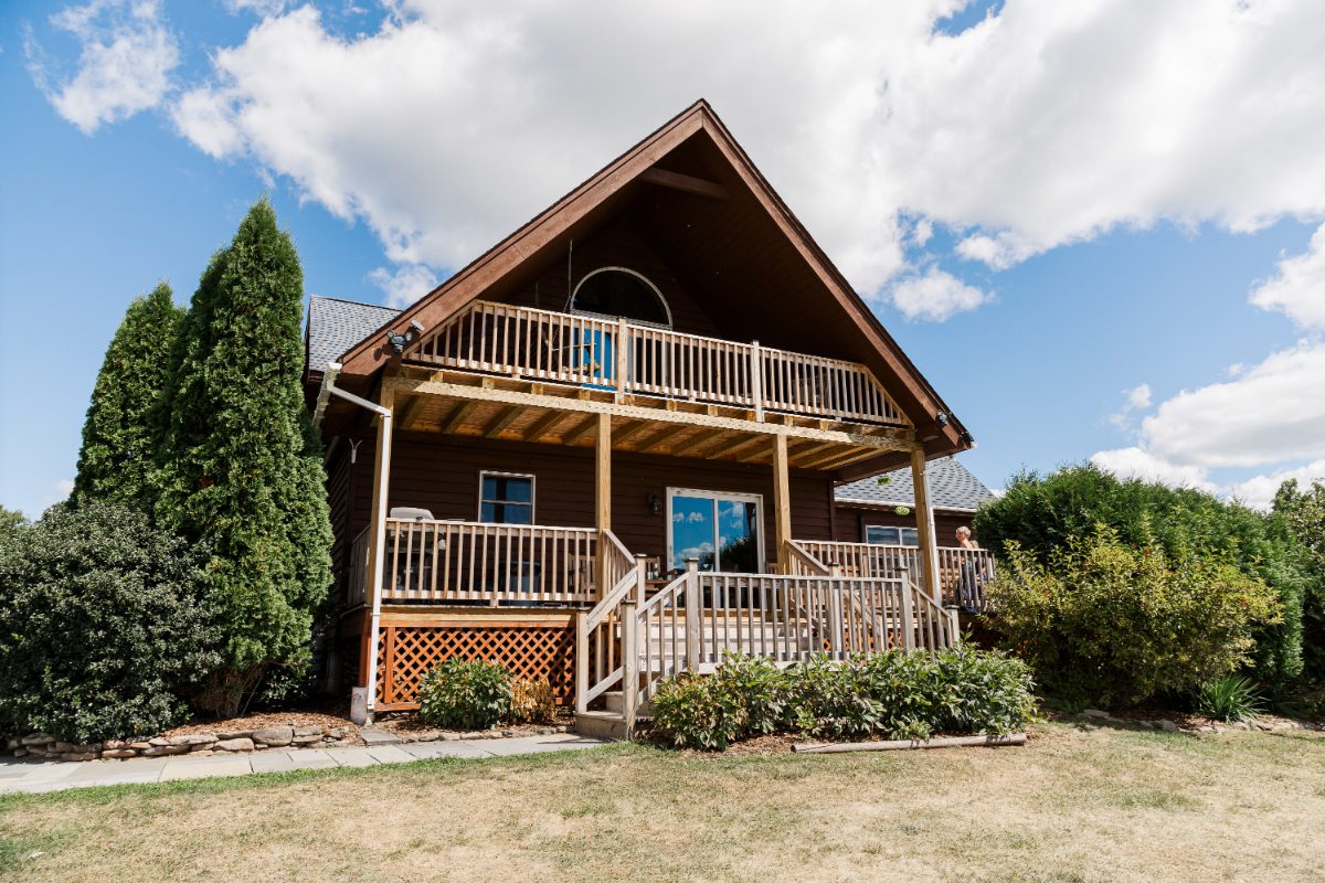 Modern cabin-style lodging at Seminary Hill with wooden balconies and scenic surroundings, offering on-site accommodations for guests attending destination weddings in Hudson Valley.