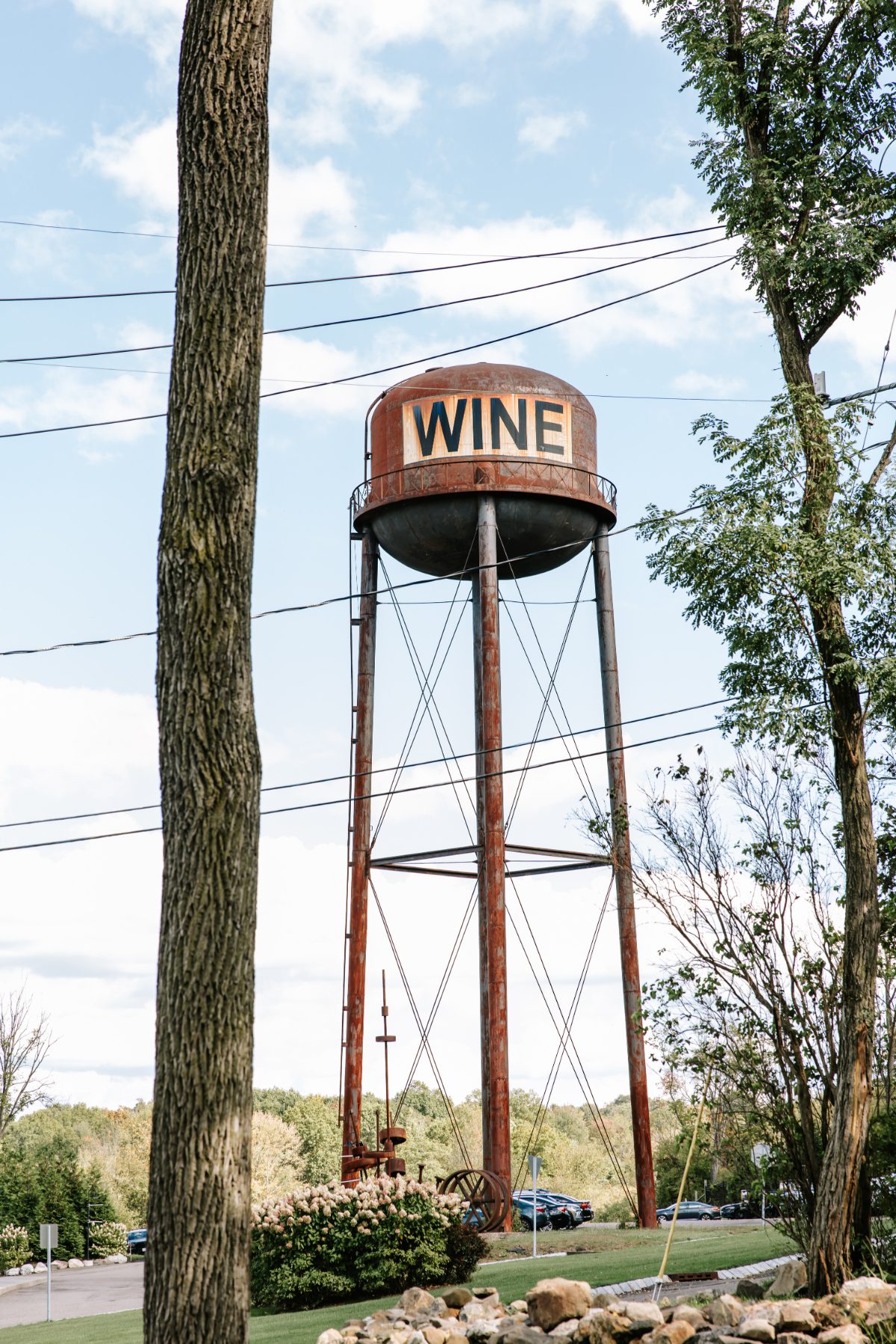 Vintage water tower labeled “WINE” rising above the property at City Winery, adding character and a unique visual element to destination weddings in Hudson Valley.